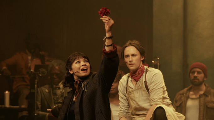 Hadestown_EvaHoldingUpFlower